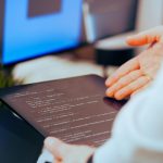 A person building a no-code software business using visual development tools.