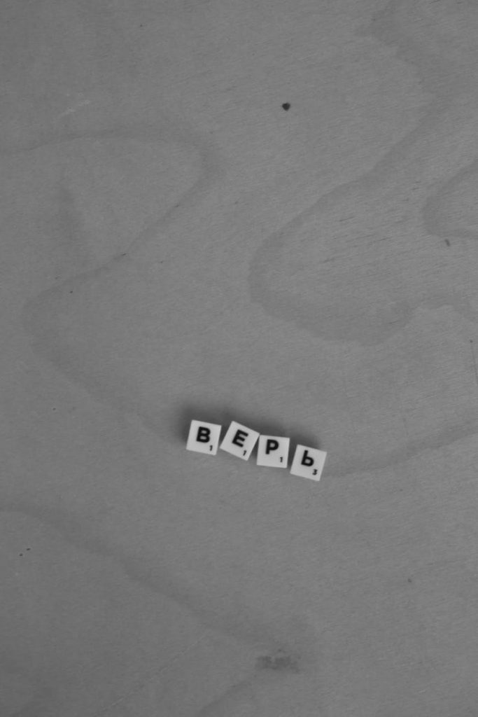 Illustration of a person relaxing on a beach with a laptop, representing financial independence and early retirement.