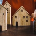 A person analyzing house flipping strategies using creative financing.