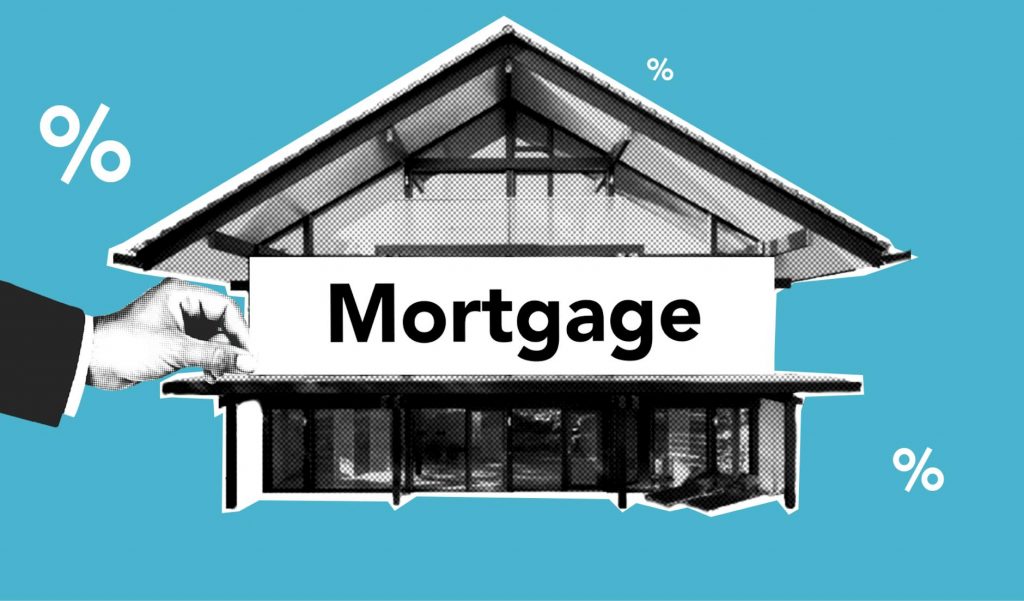 A person reviewing mortgage documents with a calculator.