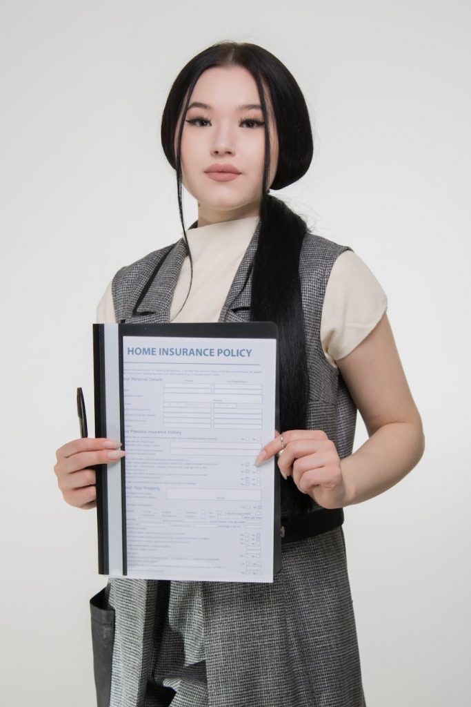 A person reviewing disability insurance documents at a desk.